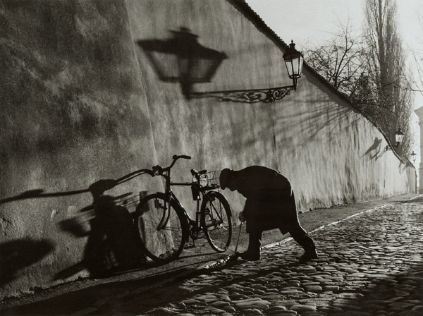 Untitled (Man Repairing Bicycle Tire) Untitled (Man Repairing Bicycle Tire)