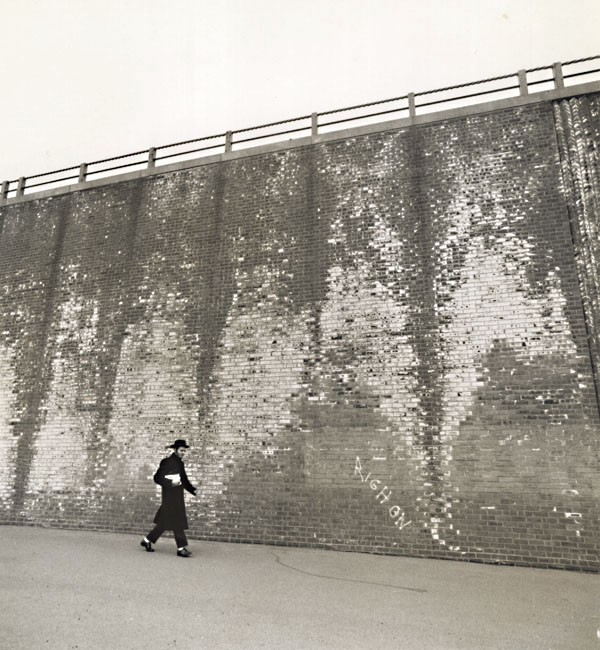 A Hassidic Rabbi Walks across a Highway Underpass, Brooklyn, NY