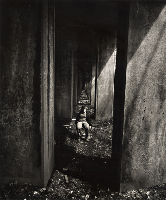 A Boy Sits under an Abandoned Railroad Track, Staten Island, NY A Boy Sits under an Abandoned Railroad Track, Staten Island, NY
