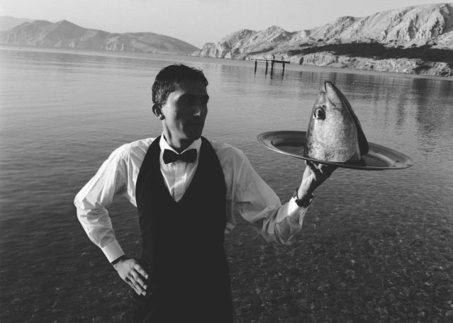 Waiter Serving Fish Head Waiter Serving Fish Head